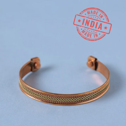 Two-tone copper bracelet. Adjustable, interlaced, copper and brass finishes.